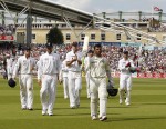 Dravid carries his bat