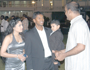 Shiv holds his Great Grandson in his arms. 