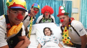 For the guy in the red wig, we imagine it was convenient this photo was taken in a hospital.